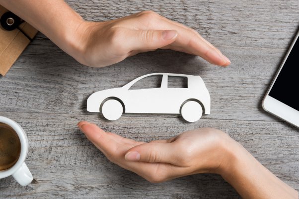 axiom features moxa vehicle service contracts hands protecting white toy car 
